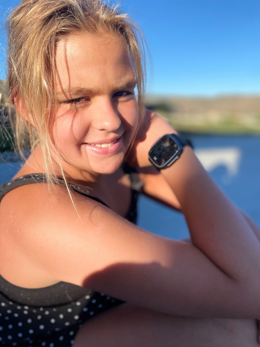young girl with digital watch