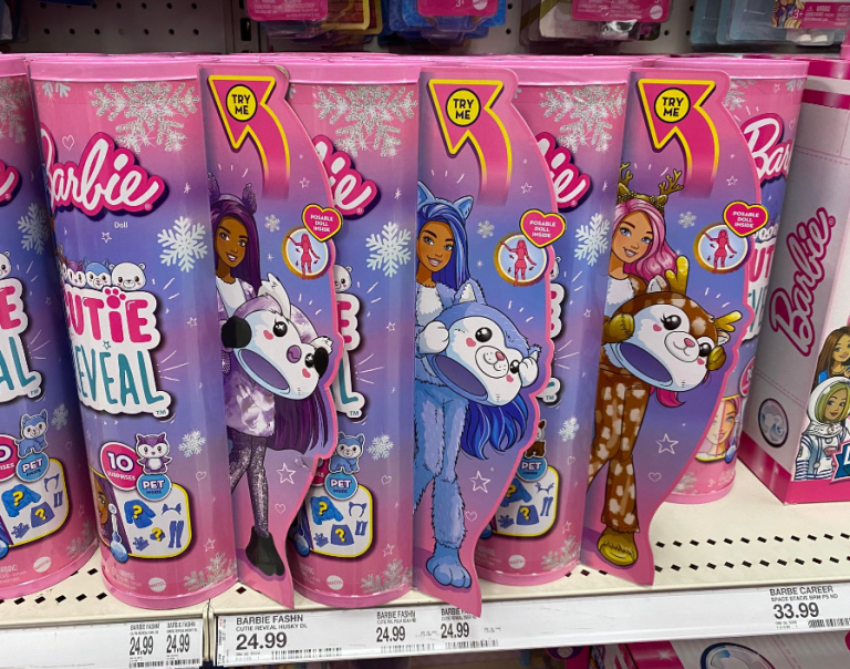 Row of Barbie Cutie Reveal Snowflake Sparkle Dolls on a shelf at Target