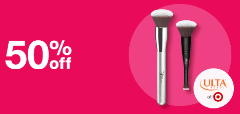 IT Cosmetics brushes on a pink background