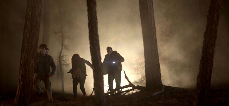 Family running from wildfire in the movie on fire