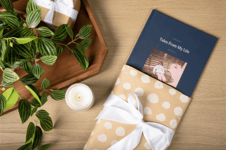 Remento book on wood table with plant and candle